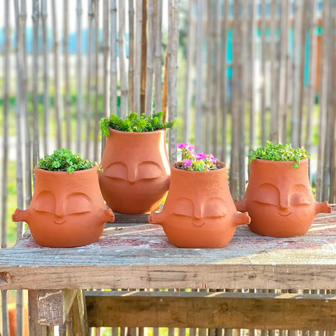 Maceteros con caras